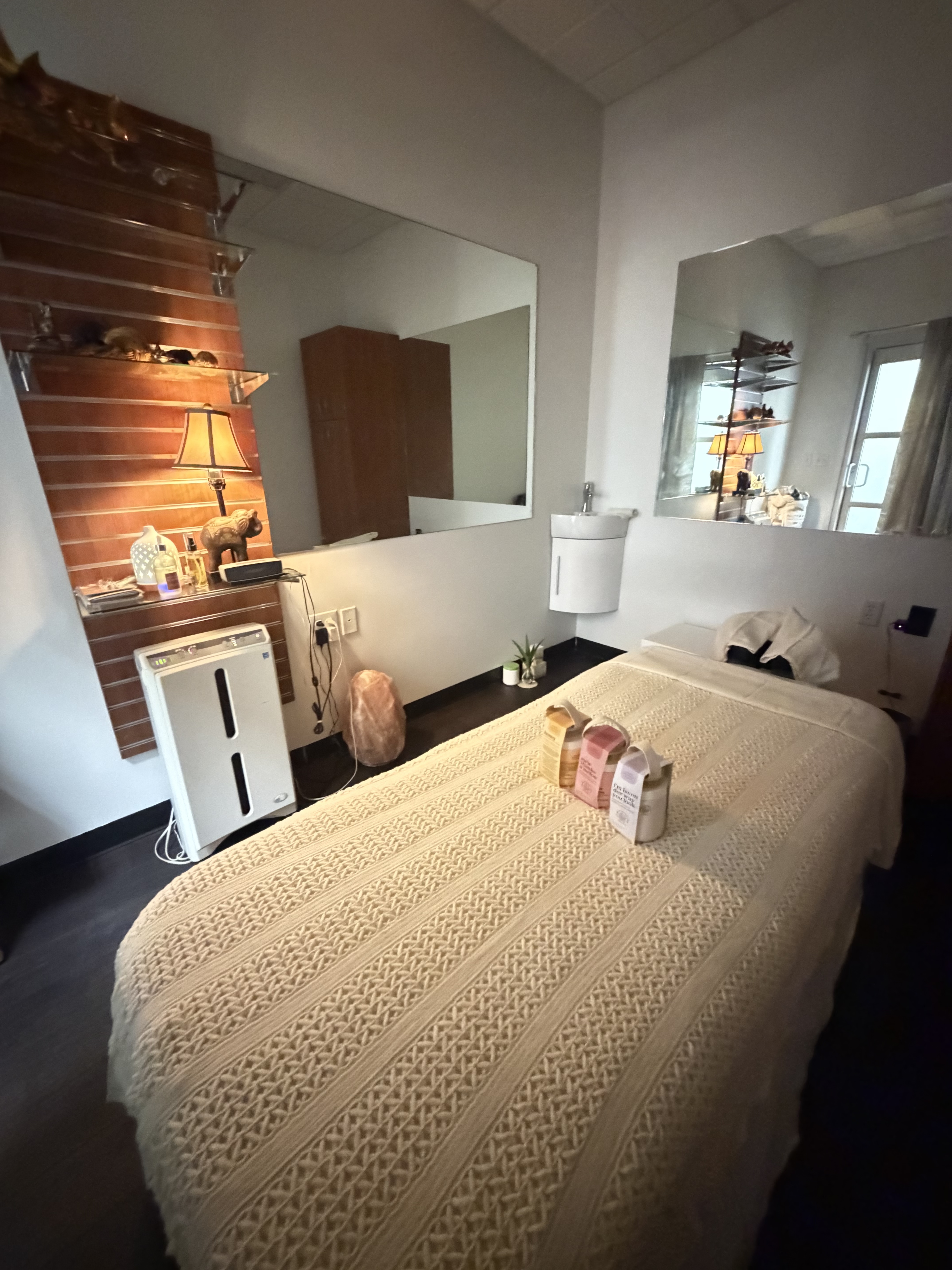Candlelit treatment room at Kao Thai Wellness — warm, serene ambiance